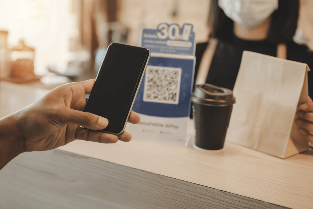 Benefits of AI: customer scanning a QR code using her phone