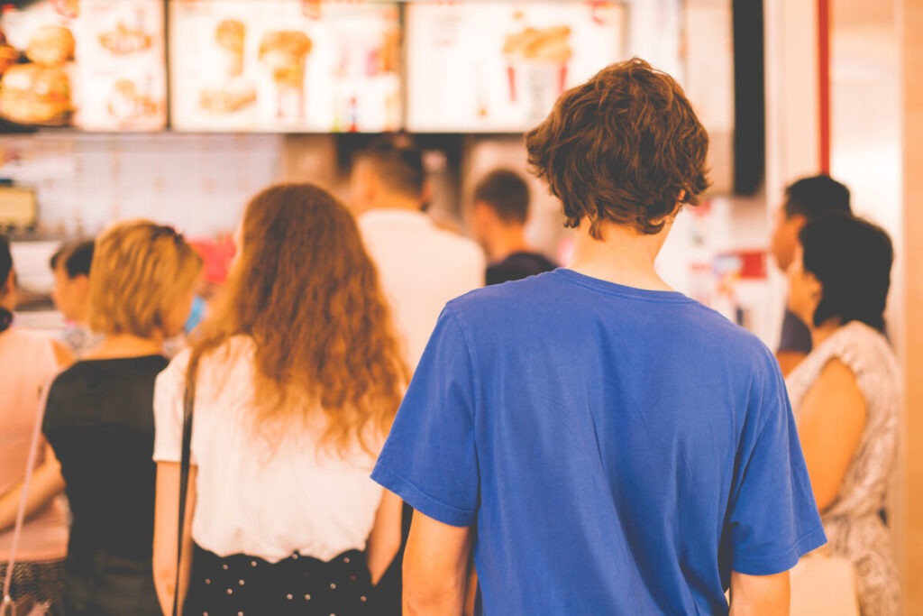 Most profitable fast food chains: people in line at a fast food chain